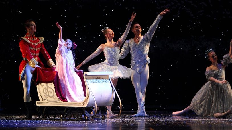 Clara is escorted by her Cavalier and the Snow King and Snow Queen off to the Land of Sweets in Dayton Ballet’s The Nutcracker.