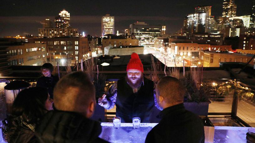 Bartender Nick Kosevich takes drink orders at Hewing Hotel&apos;s rooftop ice bar on Dec. 22, 2017 in Minneapolis. (Anthony Souffle/Minneapolis Star Tribune/TNS)