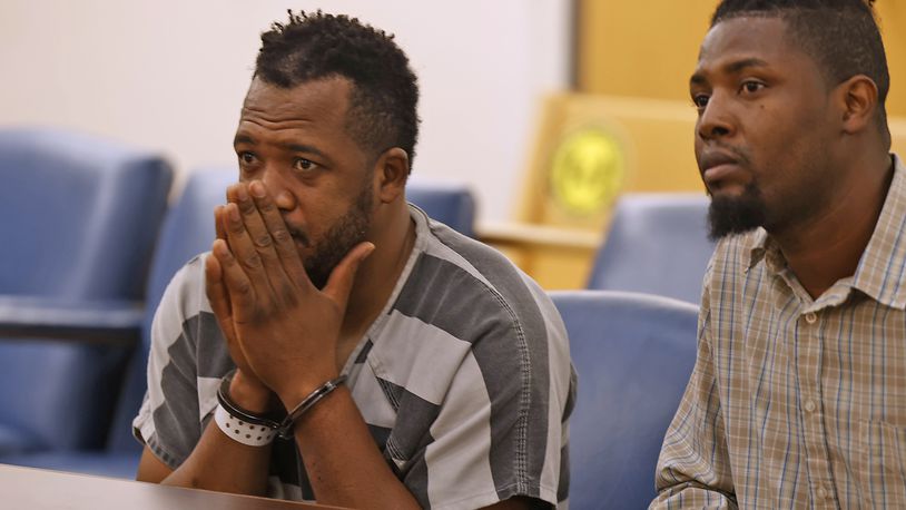 Hermanio Joseph, left, sits with interpreter Sony Auguste as he's arraigned in Clark County Municipal Court Thursday, Aug. 24, 2023. Joseph now is charged with vehicular homicide and involuntary manslaughter in the fatal Northwestern school bus crash on Aug. 22. BILL LACKEY/STAFF