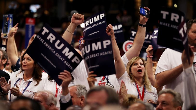 CLEVELAND, OH - JULY 19: Delegates hold signs in support of presumptive Republican presidential candidate Donald Trump during roll call on the second day of the Republican National Convention on July 19, 2016 at the Quicken Loans Arena in Cleveland, Ohio. An estimated 50,000 people are expected in Cleveland, including hundreds of protesters and members of the media. The four-day Republican National Convention kicked off on July 18. (Photo by Joe Raedle/Getty Images)