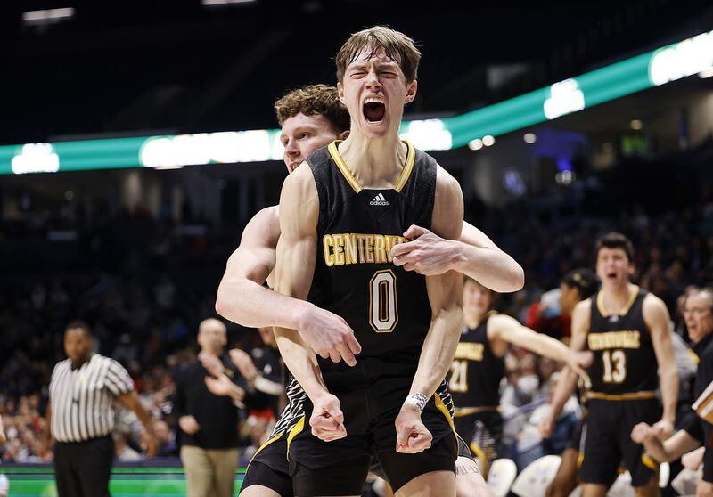 Centerville's Gabe Cupps jumps up with emotion after making a fade away shot and drawing a foul during their Division I regional basketball game against Kettering Fairmont Wednesday, March 9, 2022 at Cintas Center on the Xavier University campus in Cincinnati. Centerville won 44-42. GRAHAM/STAFF