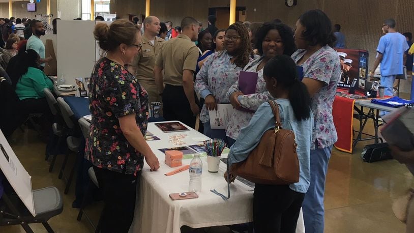 Ponitz Career Tech Center students who are certified as dental assistants meet with potential employers at a school job fair in 2019. JEREMY P. KELLEY / STAFF