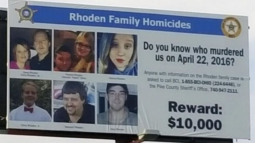 Crews installed a billboard on Ohio  23 north in Waverly, near the Pike County Sheriff's Office, in advance of the one-year anniversary of the Rhoden family murders on April 22, 2016. The billboard promotes the $10,000 reward for information leading to a conviction in the eight unsolved homicides. The billboard company donated the space, and Sheriff Charles Reader used Furtherance of Justice funds from his office to cover the cost. Holly Zachariah /The Columbus Dispatch