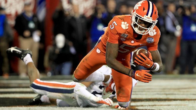CHARLOTTE, NORTH CAROLINA - DECEMBER 07: Heskin Smith #23 of the Virginia Cavaliers watches as Tee Higgins #5 of the Clemson Tigers catches a touchdown during the ACC Football Championship game at Bank of America Stadium on December 07, 2019 in Charlotte, North Carolina. (Photo by Streeter Lecka/Getty Images)