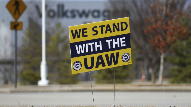 FILE - A "We stand with the UAW" sign appears outside of the Volkswagen plant in Chattanooga, Tenn., on Dec. 18, 2023. Workers at at the Tennessee factory are scheduled to finish voting Friday, April 19, 2024, on whether they want to be represented by the United Auto Workers union. (Olivia Ross/Chattanooga Times Free Press via AP, File)
