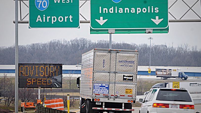The Ohio Department of Transportation has placed extra signage at the entrance to the flyover ramp from I-75 north bound to I-70 west after the latest overturned truck closed the ramp for hours on Thursday. MARSHALL GORBY / STAFF