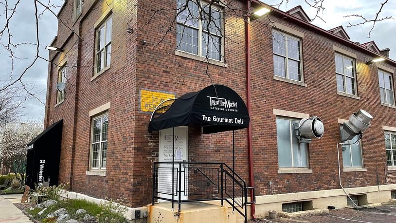 The Gourmet Deli at Top of the Market on Webster Street in Dayton is permanently closed, according to a sign posted at the restaurant. NATALIE JONES/STAFF