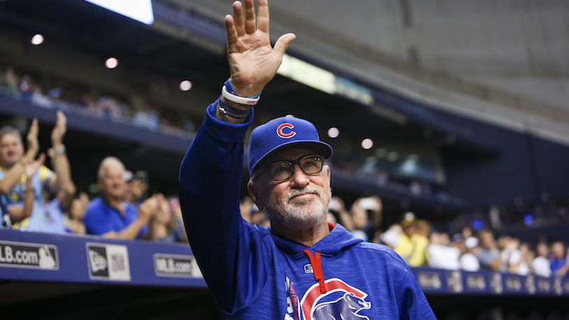 Chicago Cubs manager Joe Maddon waves to the crowd after  video tribute played on the scoreboard in the second inning against his former team, the Tampa Bay Rays, at Tropicana Field in St. Petersburg, Fla., on Tuesday, Sept. 19, 2017. (Will Vragovic/Tampa Bay Times/TNS)