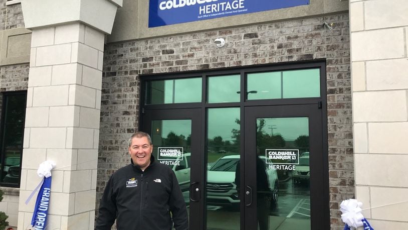 Managing Partner Ron Sweeney stands outside Coldwell Banker Heritage’s office on Yankee Street. FILE