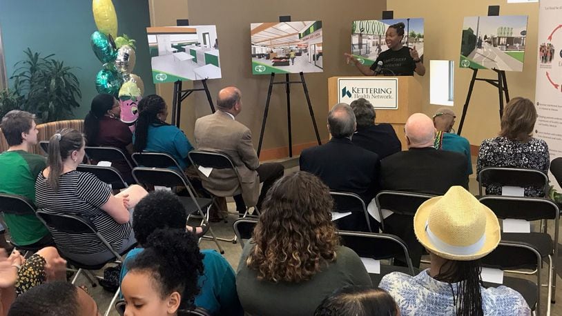 Rachel Blanks, DPS teacher and healthy food advocate, speaks at a presentation detailing the teaching kitchen planned at Gem City Market. KAITLIN SCHROEDER