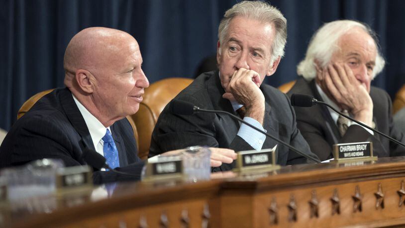 House Ways and Means Committee Chairman Kevin Brady, R-Texas, left, introduced an amendment to the House tax reform bill that reinstates a tax credit for families that adopt children. The credit was eliminated in earlier versions of the plan. (AP Photo/J. Scott Applewhite)