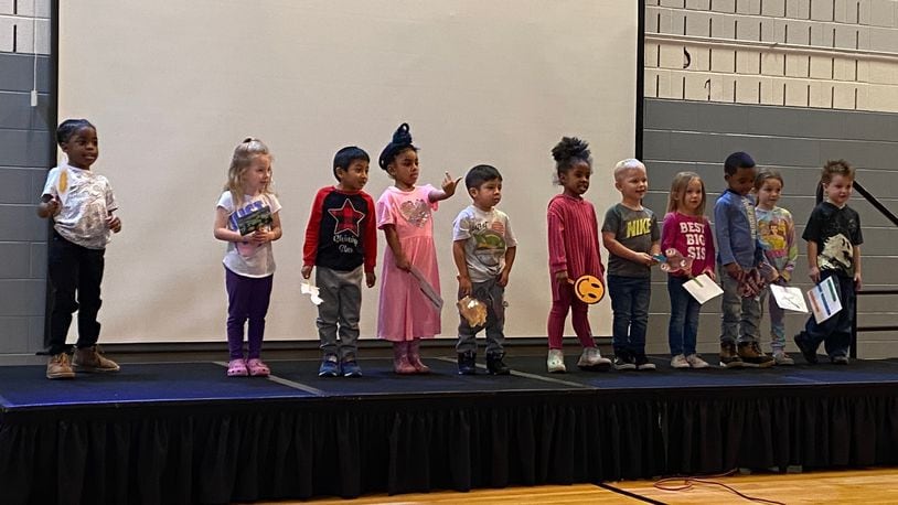 Children who attend Stepping Stones Learning Center, a Preschool Promise site, performed songs for the people who attending a Preschool Promise lunch on Tuesday. Eileen McClory / Staff