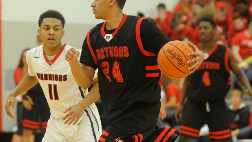 Trotwood’s Torrey Patton (with ball) is covered by Wayne’s Rodrick Caldwell. Wayne defeated visiting Trotwood-Madison 82-61 in a boys high school basketball GWOC crossover game on Tuesday, Jan. 26, 2016. MARC PENDLETON / STAFF