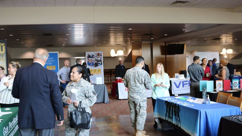 Participants and company officials talk during RecruitMilitary’s All-Veteran Career Fair in 2016. This year’s installment is scheduled for 11 a.m. to 3 p.m. Thursday, May 25, at Paul Brown Stadium.