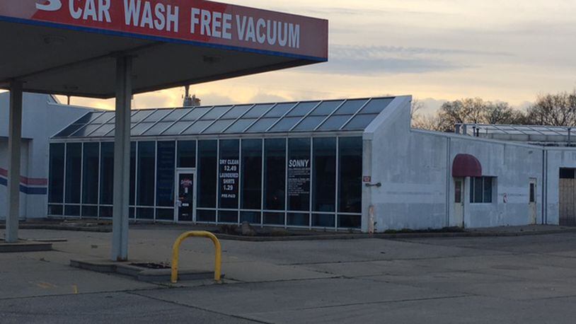 West Carrollton plans to demolish a former car wash where the Kettering Health Network plans a facility as part of a three-way deal with Montgomery County. NICK BLIZZARD/STAFF