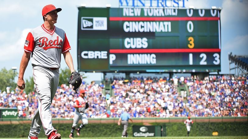 CHICAGO, IL - AUGUST 26: Homer Bailey #34 of the Cincinnati Reds walks to the dugout after the first inning against the Chicago Cubs at Wrigley Field on August 26, 2018 in Chicago, Illinois.  All players across MLB will wear nicknames on their backs as well as colorful, non traditional uniforms featuring alternate designs inspired by youth-league uniforms during Players Weekend.  (Photo by Stacy Revere/Getty Images)