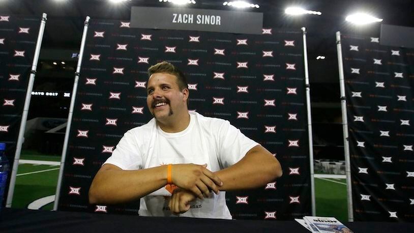 Oklahoma State punter Zach Sinor smiles while giving an interview during the Big 12 NCAA college football media day in Frisco, Texas, Tuesday, July 18, 2017. (AP Photo/LM Otero)