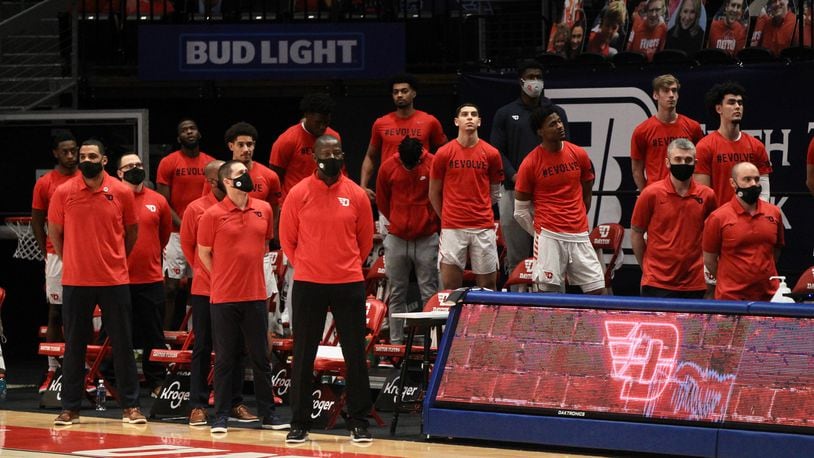 Dayton stands for the national anthem before a game against Saint Louis on Friday, Feb. 19, 2021, at UD Arena. David Jablonski/Staff
