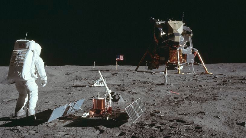 A photo provided by Project Apollo Archive/NASA of seismometers being deployed on the moon by Apollo 11 astronauts in 1969. A new study suggests that shallow moonquakes were triggered across myriad young faults by a combination of escaping internal heat and Earth’s gravitational pull. (Project Apollo Archive/NASA via The New York Times)