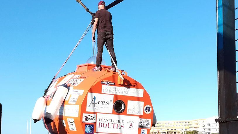 In this photograph taken Dec. 22, Jean-Jacques Savin stands on top of his barrel-shaped capsule.