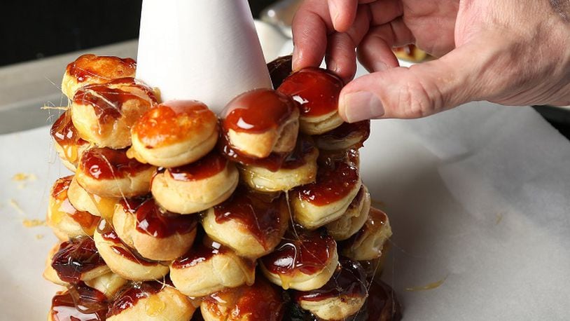 While croquembouche as a whole is daunting, when broken down into its individual parts it actually goes easily, though it does take time. (Chris Lee/St. Louis Post-Dispatch/TNS)