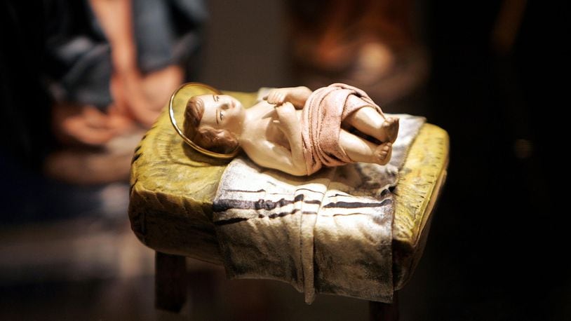 FILE PHOTO: A sculpture of a baby Jesus that is part of a nativity scene from Spain is displayed during a "Joy to the World"  exhibit .