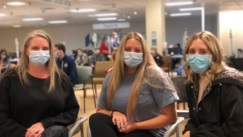 Missy Kozee and her daughters Jordyn, 17, and Alyssa, 22. Kozee was vaccinated a few weeks ago. Alyssa, a medical student, was vaccinated in February. Jordyn received her first shot at a Kettering Health Network clinic on Friday. CORNELIUS FROLIK / STAFF