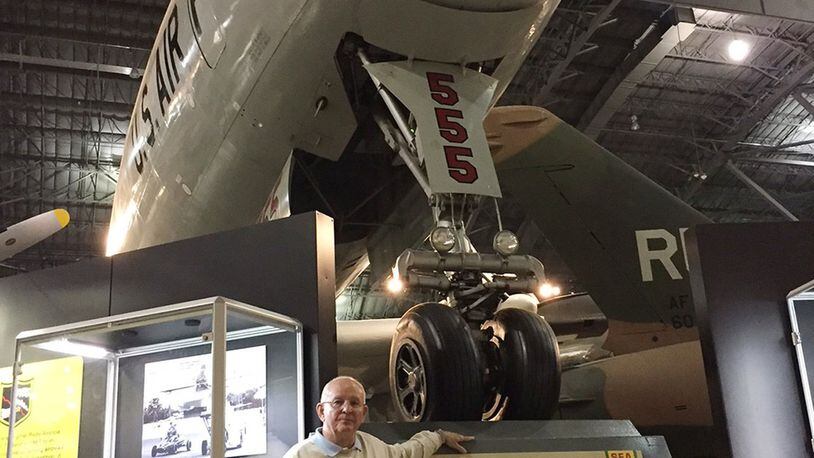 Robert Sargent, a retired master sergeant and radar crew chief once stationed at Wright-Patterson Air Force Base, stands beneath the Lockheed EC-121D Constellation ‘Triple Nickel’he flew on that stands in the Southeast Asia War Gallery at the National Museum of the U.S. Air Force. (Skywrighter photo/Amy Rollins)