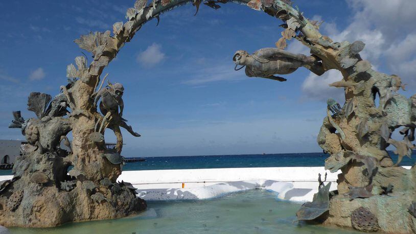 A sculpture depicting scuba divers illustrates the island’s importance as a diving mecca. (Patricia Harris)
