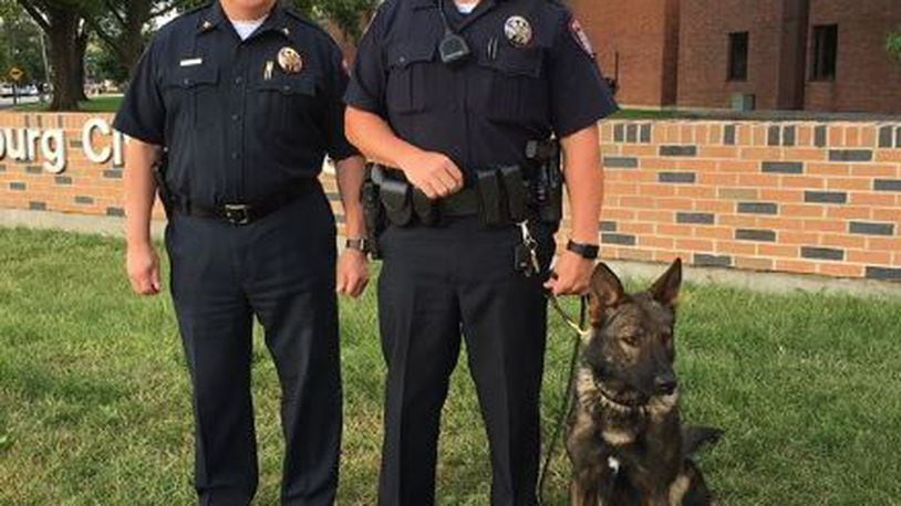 (From left): Miamisburg Police Chief John Sedlak, Officer Bryan Klein and K-9 Officer Buck. (Courtesy/Miamisburg Police Facebook)