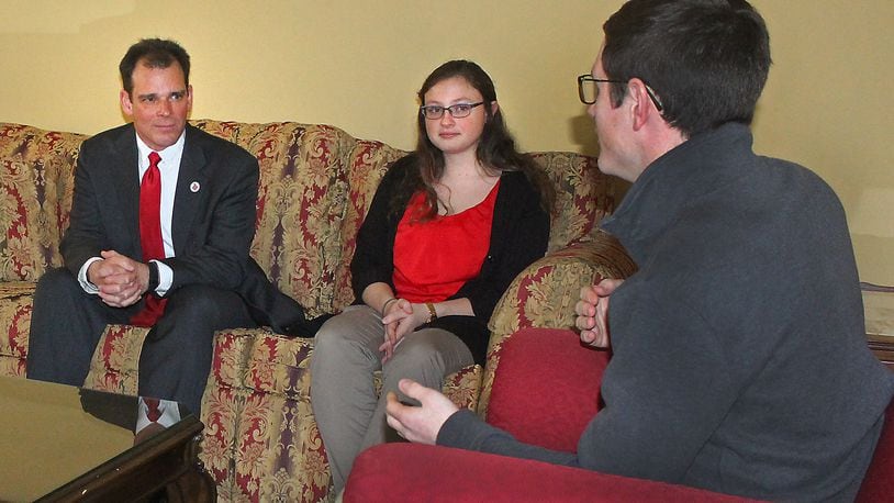 FILE: Wittenberg University President, Michael Frandsen (left) meets with students Meghan Roderick and Casey Luther at the president’s home on campus. JEFF GUERINI/STAFF