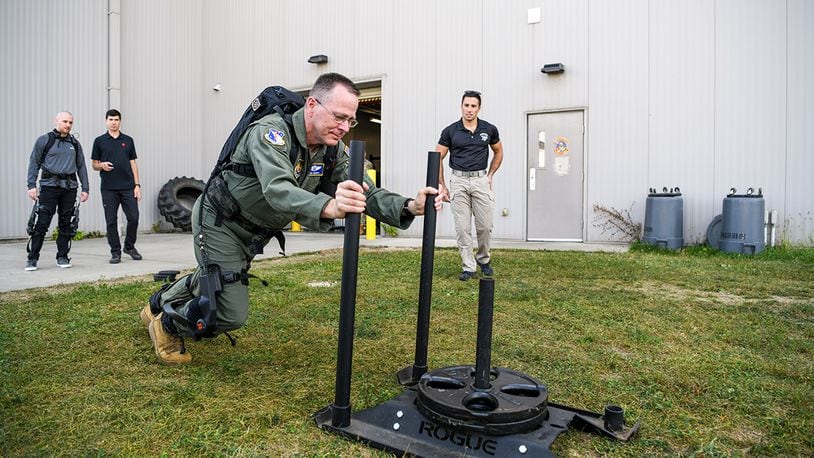 Brig. Gen. John Andrus, commander of 711th Human Performance Wing in the Air Force Research Laboratory, pushes a weighted sled while wearing the pneumatically powered exoskeleton during an AFRL demonstration Oct. 6 at the Air Force Reserve Command’s 445th Airlift Wing, Wright-Patterson Air Force Base. This technology, supported by AFRL’s Center for Rapid Innovation, was designed to assist aerial porters load and unload heavy cargo and is intended to minimize manpower needed as well as prevent injuries. (U.S. Air Force photo / Patrick O’Reilly)
