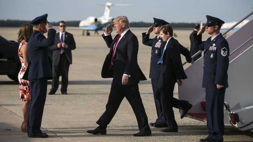 President Donald Trump and his son Barron disembark Air Force One as family of the president return from an Easter weekend in Palm Beach, at Joint Base Andrews, Md., April 16, 2017. (Al Drago/The New York Times)