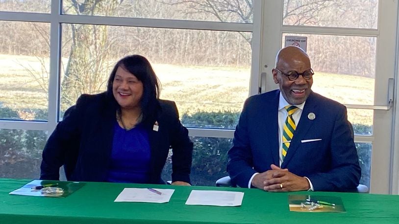 Geri Sanchez Aglipay, U.S. Small Business Association regional manager, Great Lakes Region, and Wilberforce University president Elfred A. Pinkard, sign an agreement meant to increase entrepreneurship in Black students. Eileen McClory / Staff