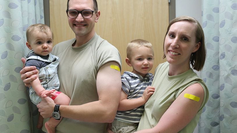 The Sidari family – Doctors Anthony and Laura Sidari and their sons Cameron and Tristan receive flu shots at the Wright-Patterson Medical Center’s immunization clinic the first week of October. (Contributed photo)