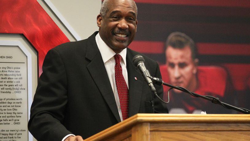 According to an ESPN report, Ohio State Athletic Director Gene Smith will help decide which college football teams get to compete for the national championship — whether Michigan coach Jim Harbaugh likes it or not. DAVID JABLONSKI / STAFF