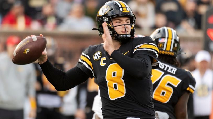 Missouri quarterback Connor Bazelak  looks to pass during the first quarter of an NCAA college football game against Florida, Saturday, Nov. 20, 2021, in Columbia, Mo. (AP Photo/L.G. Patterson)