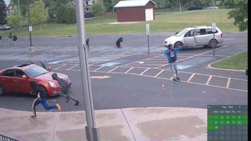 Surveillance footage from May 31 at Edwin Joel Brown Middle School in Dayton. Authorities allege the man in the photo possessed and fired a pistol in a school zone. CONTRIBUTED