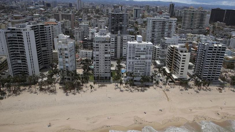 SAN JUAN, PUERTO RICO - SEPTEMBER 25: Condo buildings are seen along the beach as people deal with the aftermath of Hurricane Maria on September 25, 2017 in San Juan, Puerto Rico. Maria inflicted widespread damage across Puerto Rico, with virtually the whole island left without power or cell service.  (Photo by Joe Raedle/Getty Images)