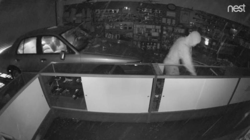 Surveillance video shows a man stealing guns from a Georgia shop.