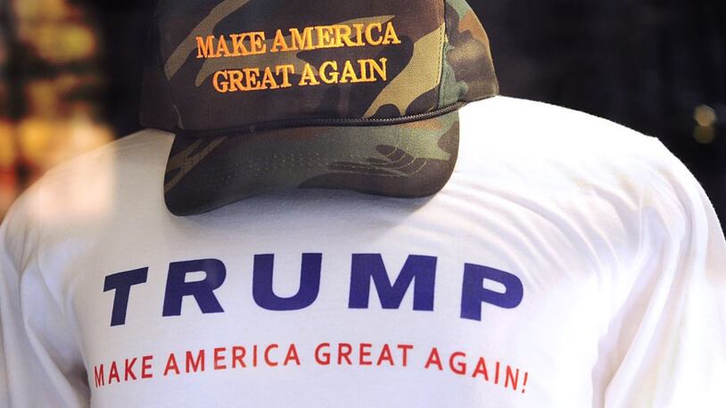 T-shirts and hats printed and embroidered with Donald Trump's presidental campaign slogan, 'Make American Great Again,' for sale in the gift shop inside Trump's Fifth Avenue Trump Tower in New York City on August 27, 2016. (Photo by Robert Alexander/Getty Images)
