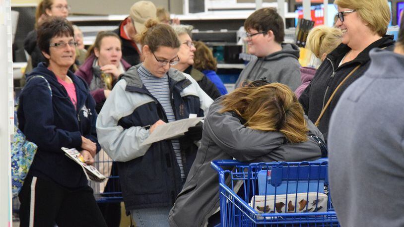 Hundreds of shoppers lined up for deals at the Kettering Meijer Thursday. STAFF PHOTO / HOLLY SHIVELY