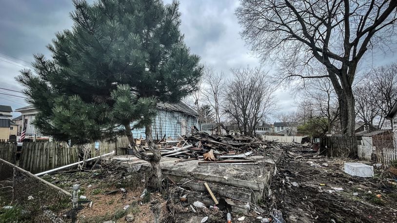 An emergency demolition was ordered for the house at 21 N. Jersey St. in Dayton after it was destroyed by a fire Tuesday night, March 26, 2024, that an arson investigator determined was intentionally set. JIM NOELKER/STAFF