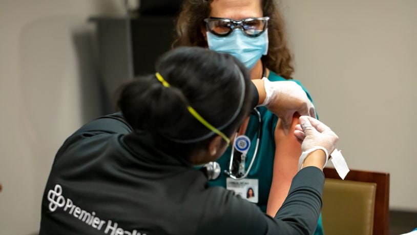 The first dose of the Moderna coronavirus vaccine (a two-dose regimen) is administered to frontline health care workers at Miami Valley Hospital. Photo provided by Premier Health.