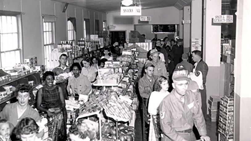 Air Force service members and families stand in line to check out their groceries at the Ellsworth Air Force Base Commissary, South Dakota, in May 1958. Courtesy photo/Defense Commissary Agency archives