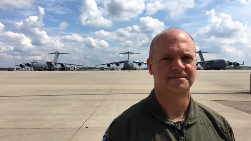 Lt. Col. Steven R. Shrader, 445th Airlift Wing deputy group operations commander, stands on the flight line Thursday in front of three C-17 jets based at Wright-Patterson Air Force Base. Wright-Patterson C-17s have been called into Hurricane Harvey relief efforts in Texas. BARRIE BARBER/STAFF