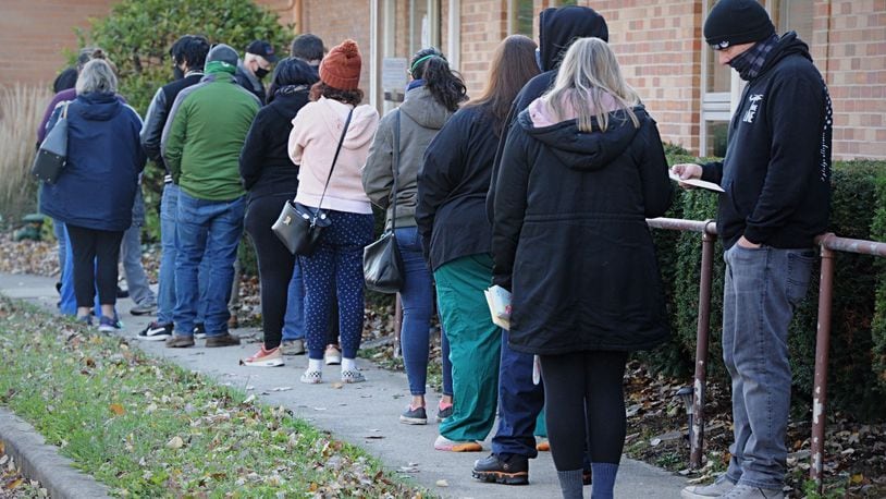 Voters wait in line Tuesday at the Central Christian Church on Forrer Blvd in Kettering. MARSHALL GORBY\STAFF