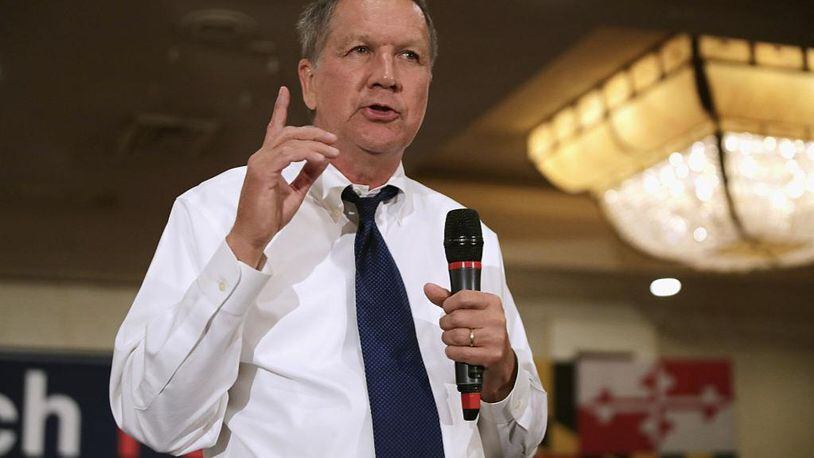 Former Ohio Gov. John Kasich holds a packed campaign town hall meeting in the ballroom at a Crowne Plaza hotel April 19, 2016 in Annapolis, MD. Kasich landed a gig with CNN as a commentator just hours after leaving office.