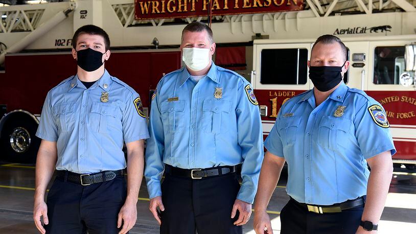 Three Air Force firefighters from the 788th Civil Engineer Squadron were promoted during a ceremony at Wright-Patterson Air Force Base on March 29. From left are new firefighter Ryan Hartmann, Lt. Chad Engman and Capt. James Hammond. U.S. AIR FORCE PHOTO/TY GREENLEES