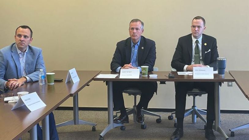 Ohio Treasurer Robert Sprague, middle, and Montgomery County Treasurer John McManus, right, listen as local business leaders shared their thoughts on inflation Tuesday. / PARKER PERRY